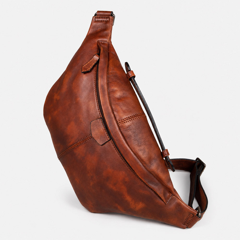 Front view of large leather shoulder bag for men with vintage-style bum bag silhouette, smooth zipper hardware, and dark brown leather finish