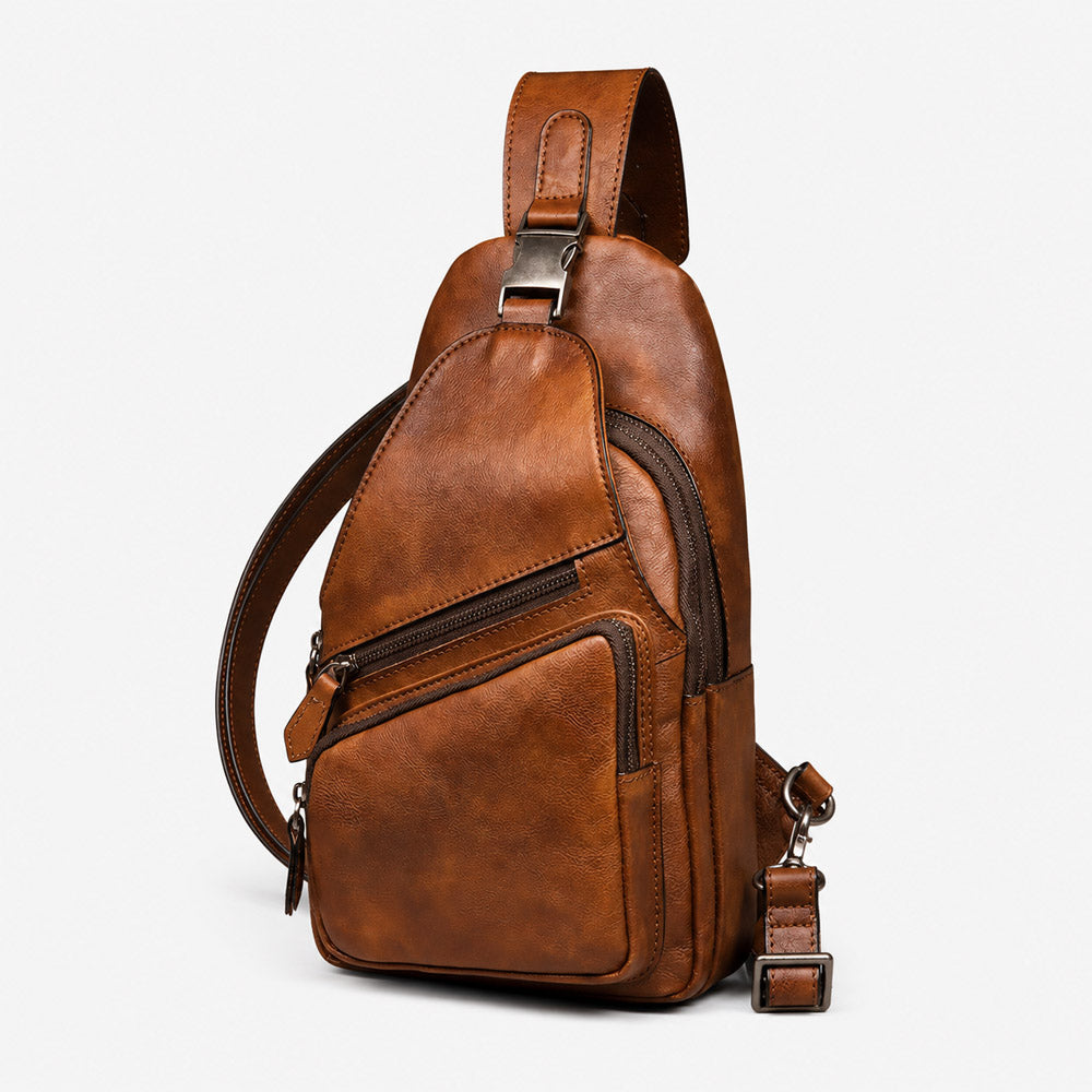Front view of vintage leather fanny pack holster with compact body-hugging shape, smooth zippers, and leather logo patch