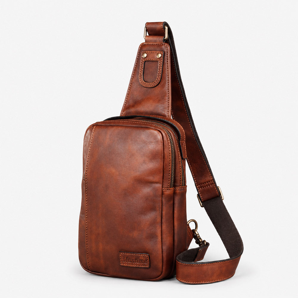 Front view of brown leather waist bag with Mantime leather logo patch, smooth zippers, and compact daily carry shape