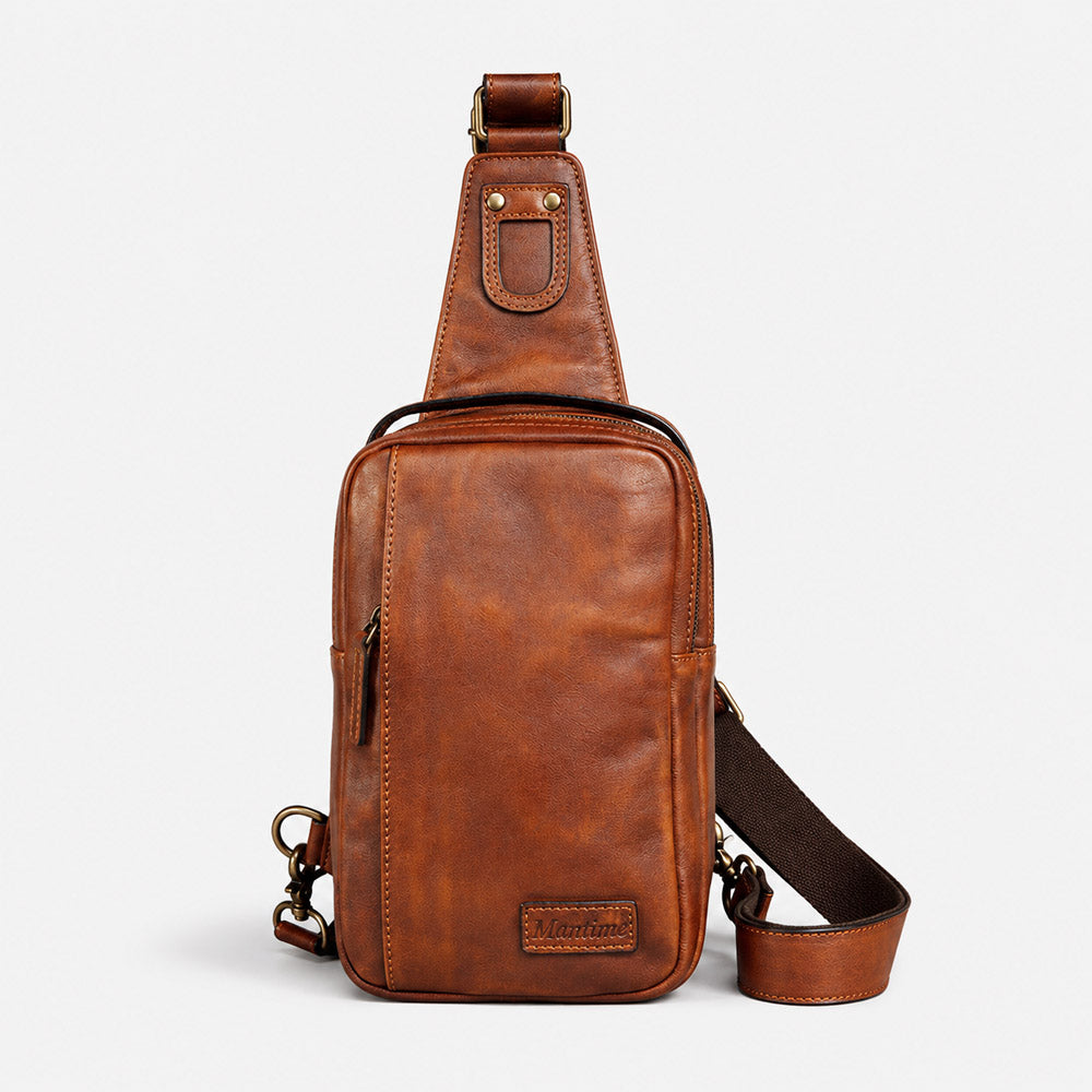Front view of brown leather waist bag with Mantime leather logo patch, smooth zippers, and compact daily carry shape