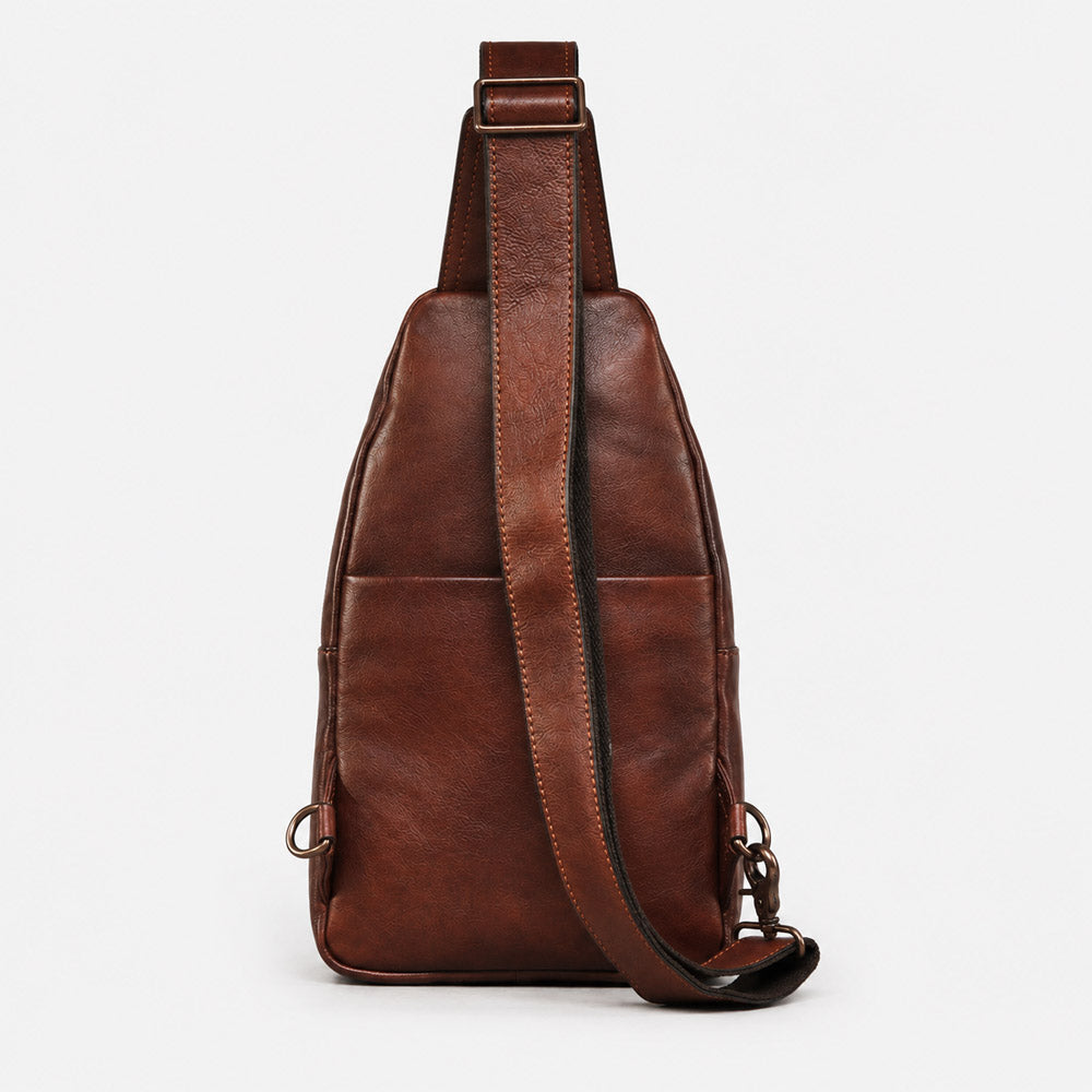 Back view of deep brown leather waist bag with adjustable strap, clean leather panel, and secure waist or crossbody carry