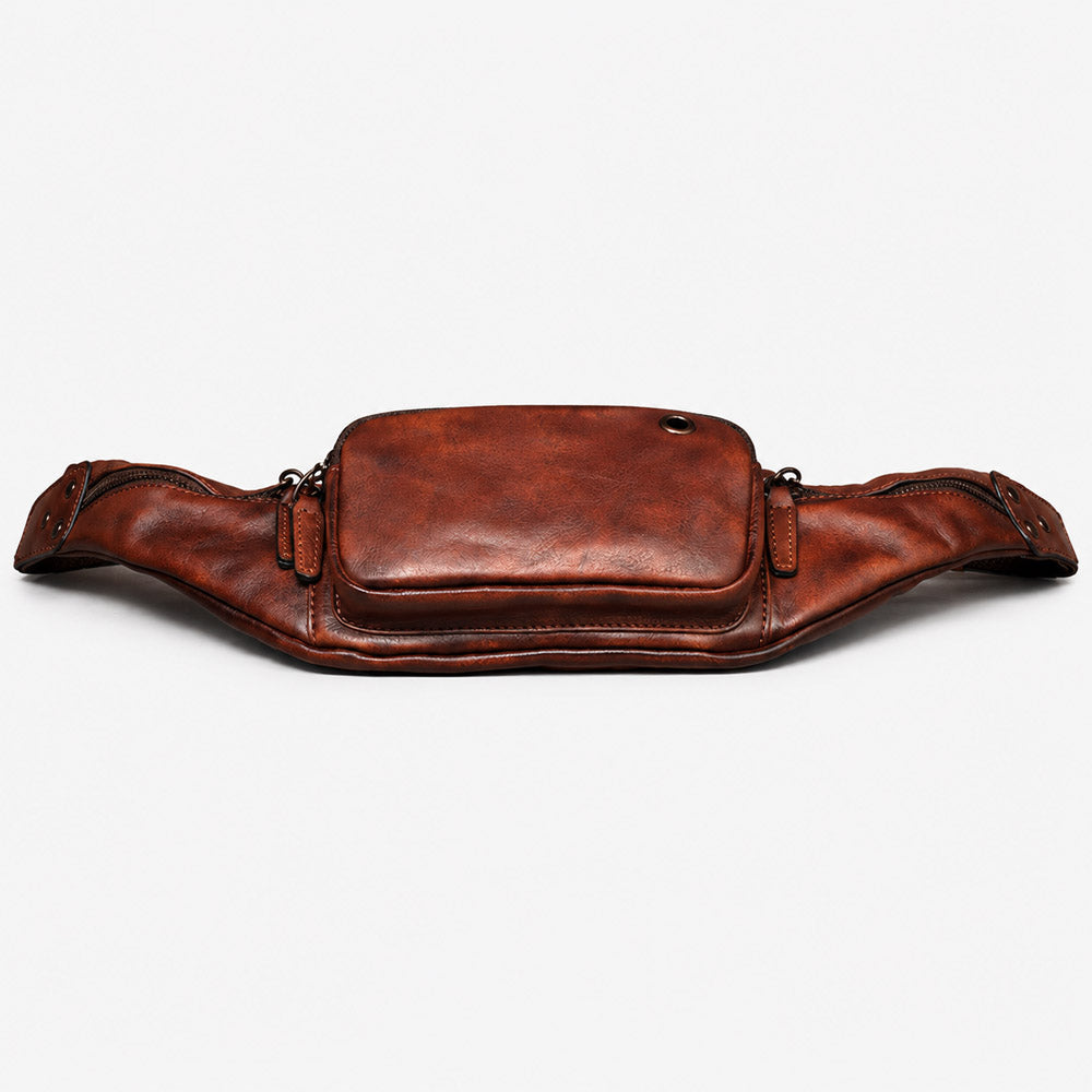 Bottom view of dark brown full-grain leather waist bag showing slim base, reinforced stitching, and vintage fanny pack construction