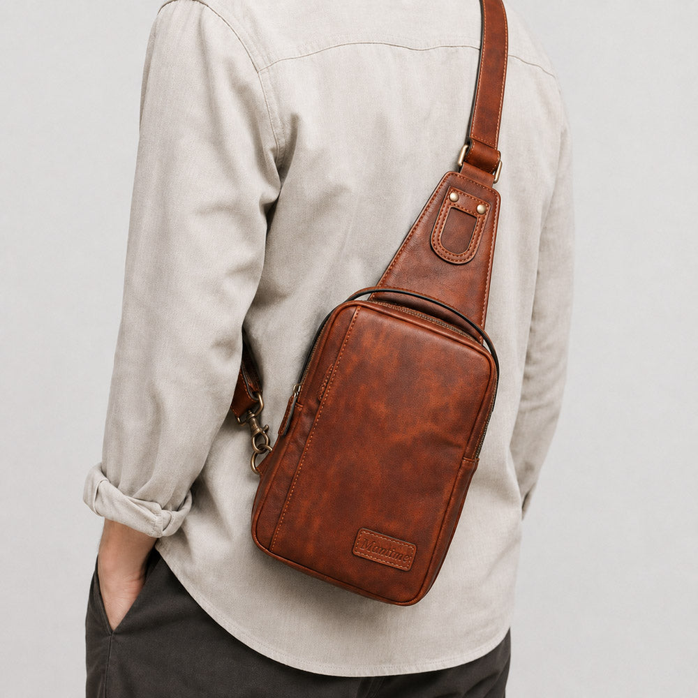 Brown leather waist bag worn crossbody on model, showing compact everyday carry fit and hands-free urban styling