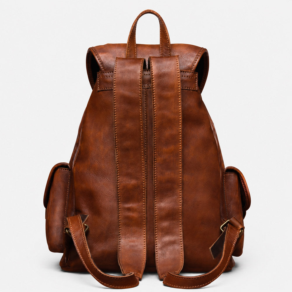 Brown leather backpack on a light gray background