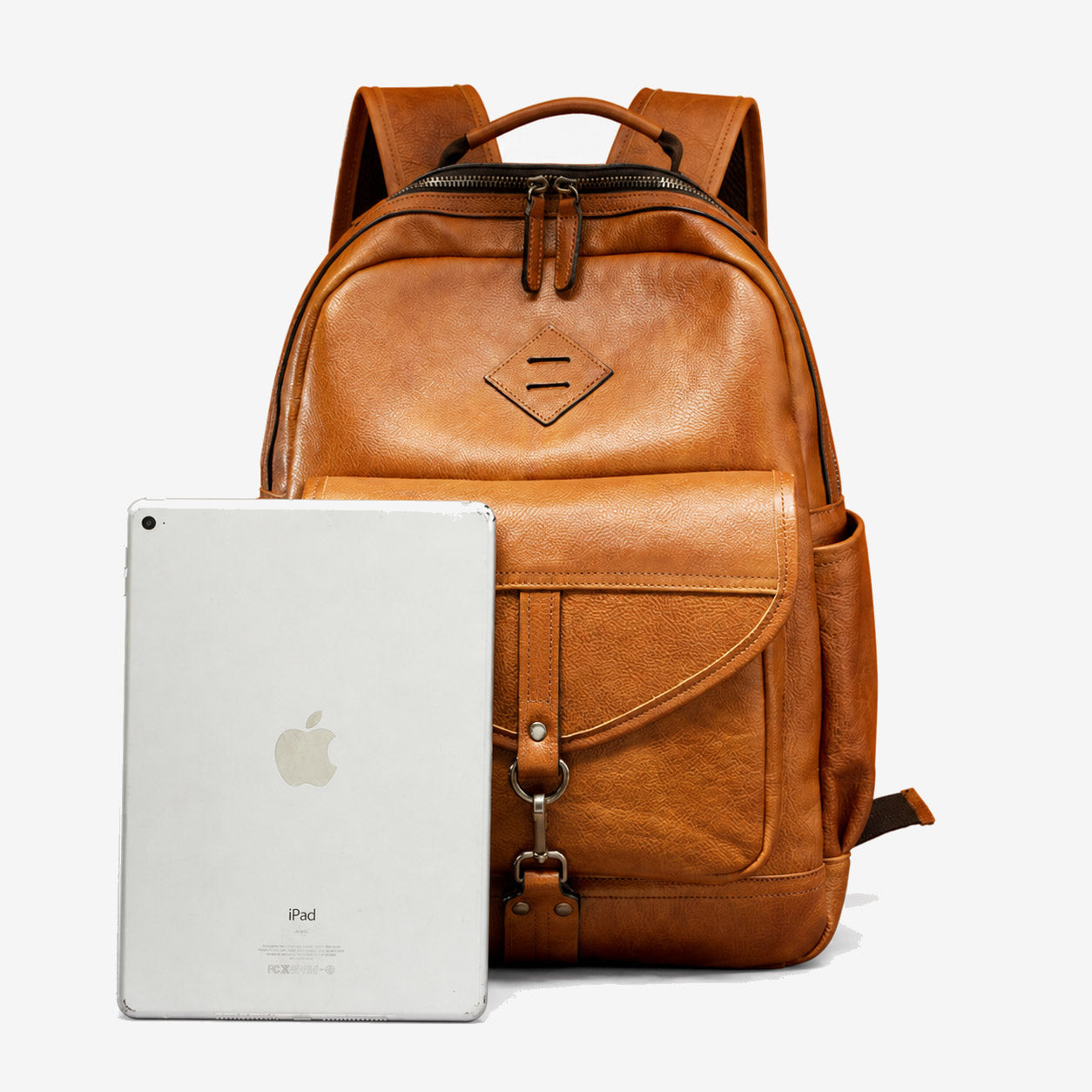 Leather backpack shown beside a tablet as a size reference