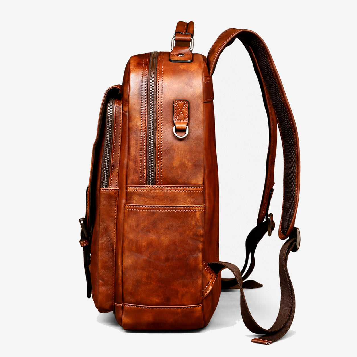 Side profile of the large leather backpack showing its 16 cm depth and D-ring