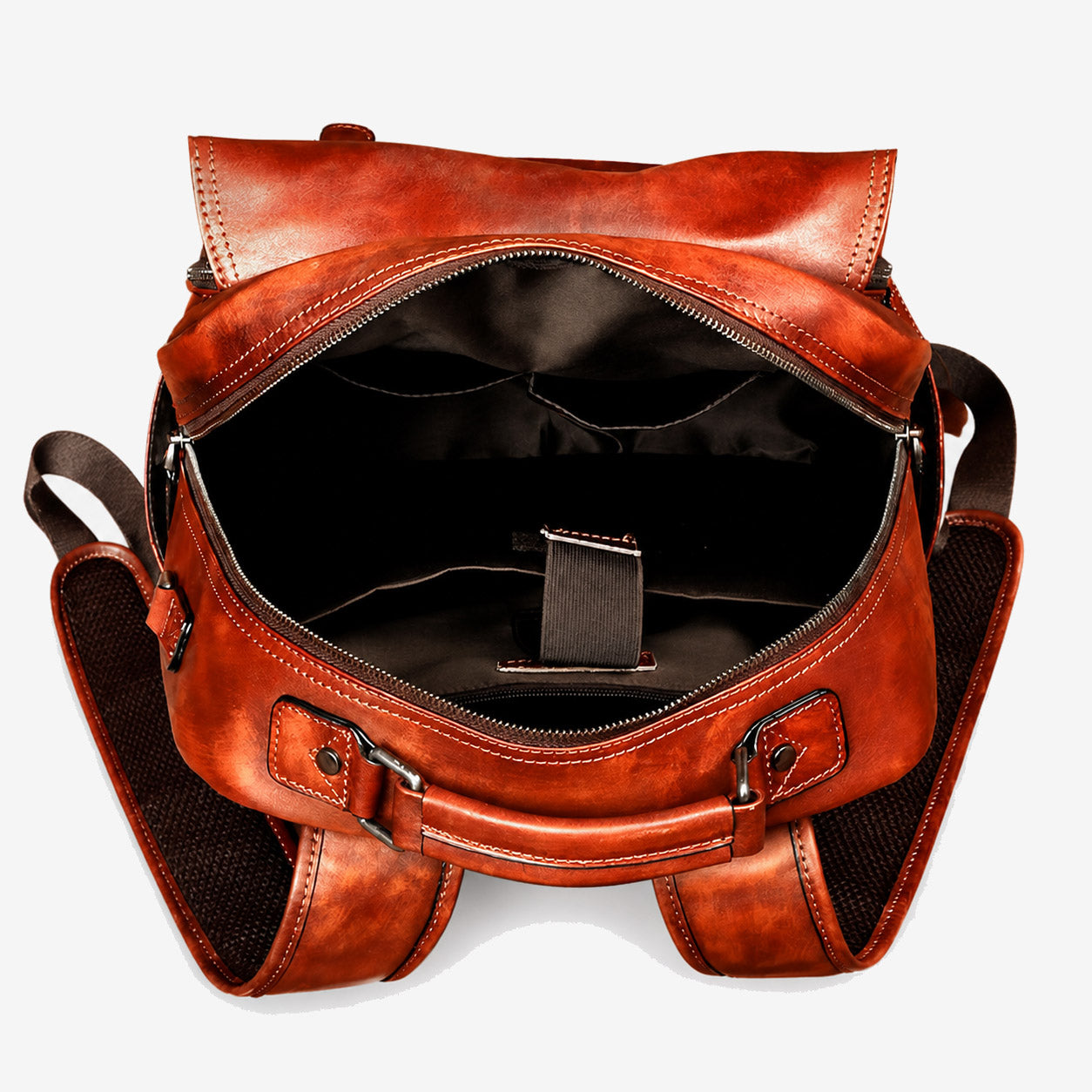 Leather backpack opened to show the main compartment, dividers and laptop strap